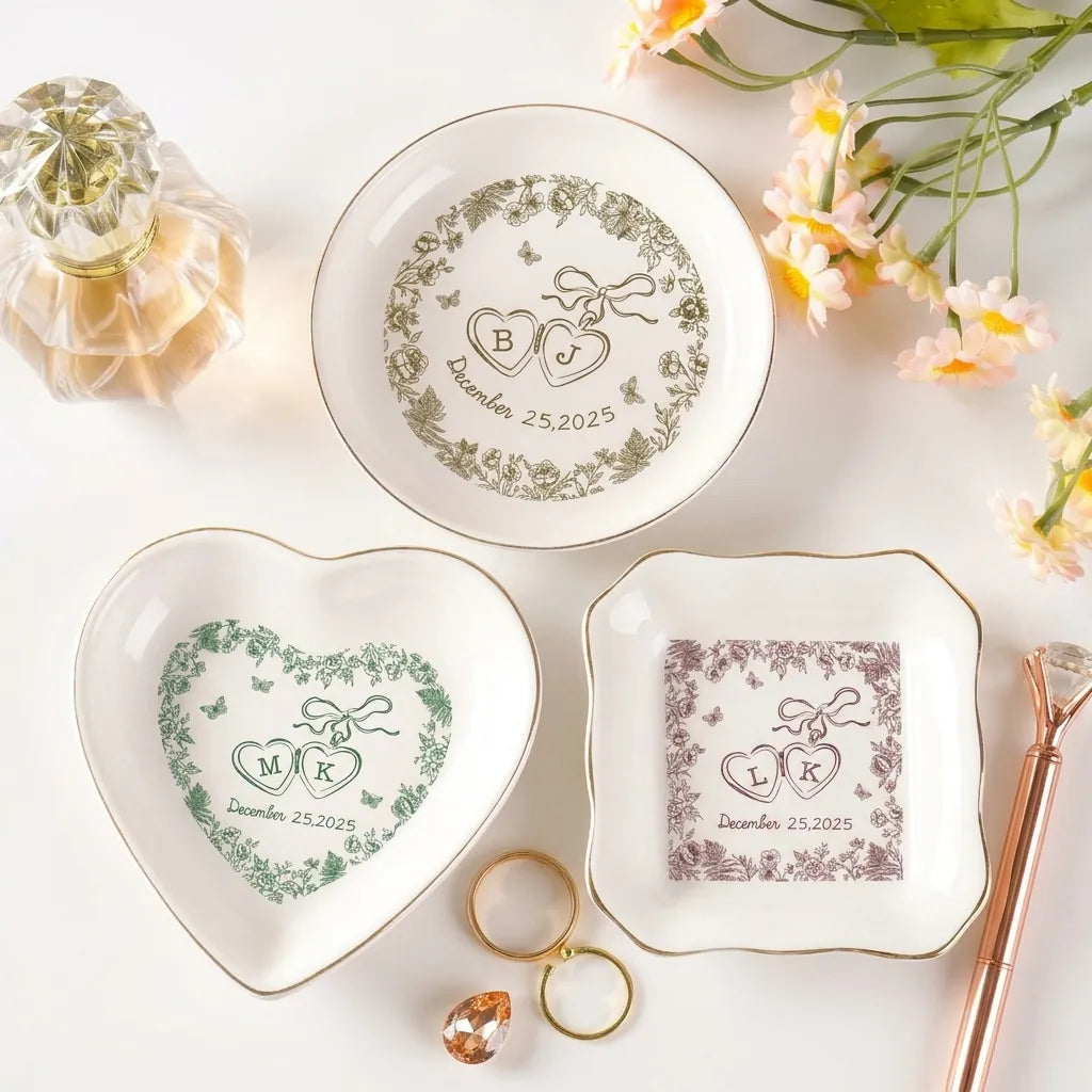 Four personalized locked-hearts floral ring dishes in multiple colors with initials and date
