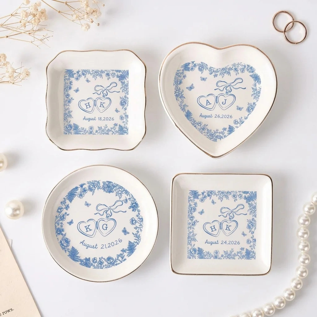 Blue toile locked-hearts wedding ring dish with gold rim on white cloth