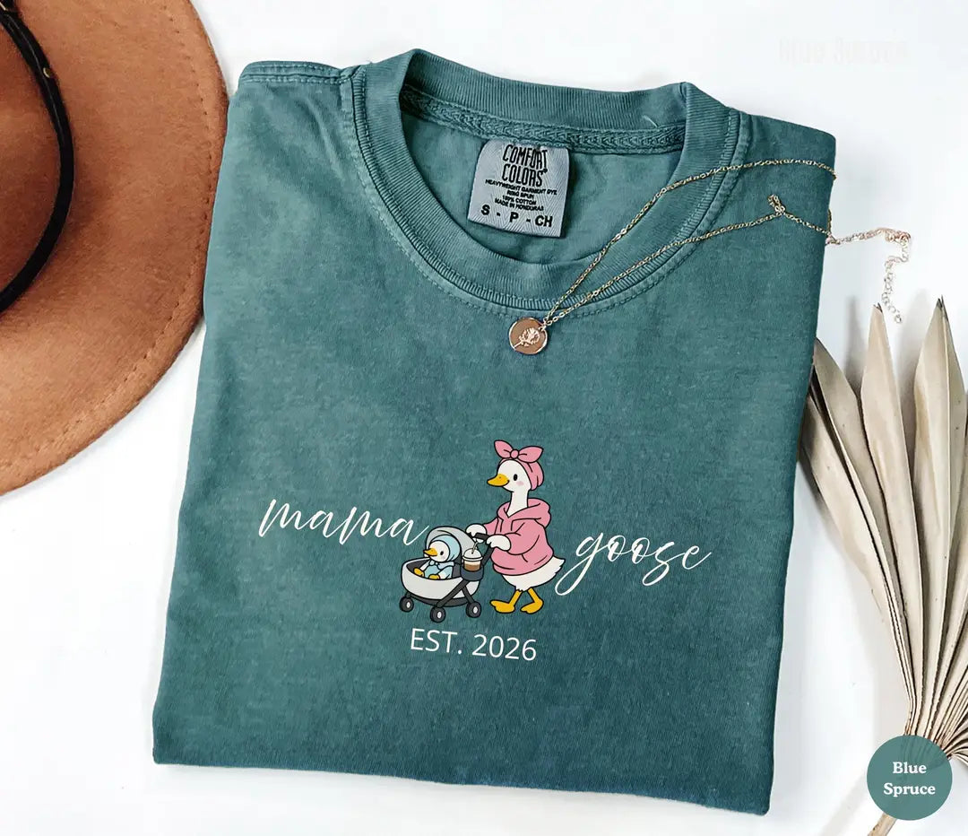Blue Spruce Comfort Colors T-shirt with embroidered-look 'mama goose' illustration and 2026 wording.