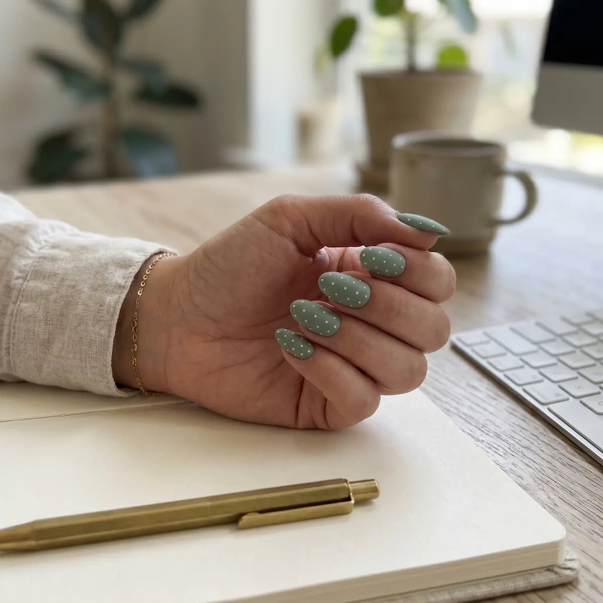 matte sage green hand painted almond press on nails white dot cross mockup 01