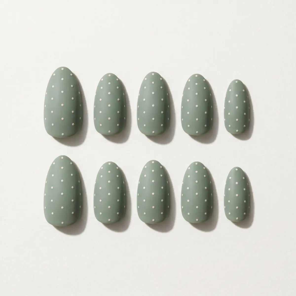 matte sage green hand painted almond press on nails white dot cross mockup 05