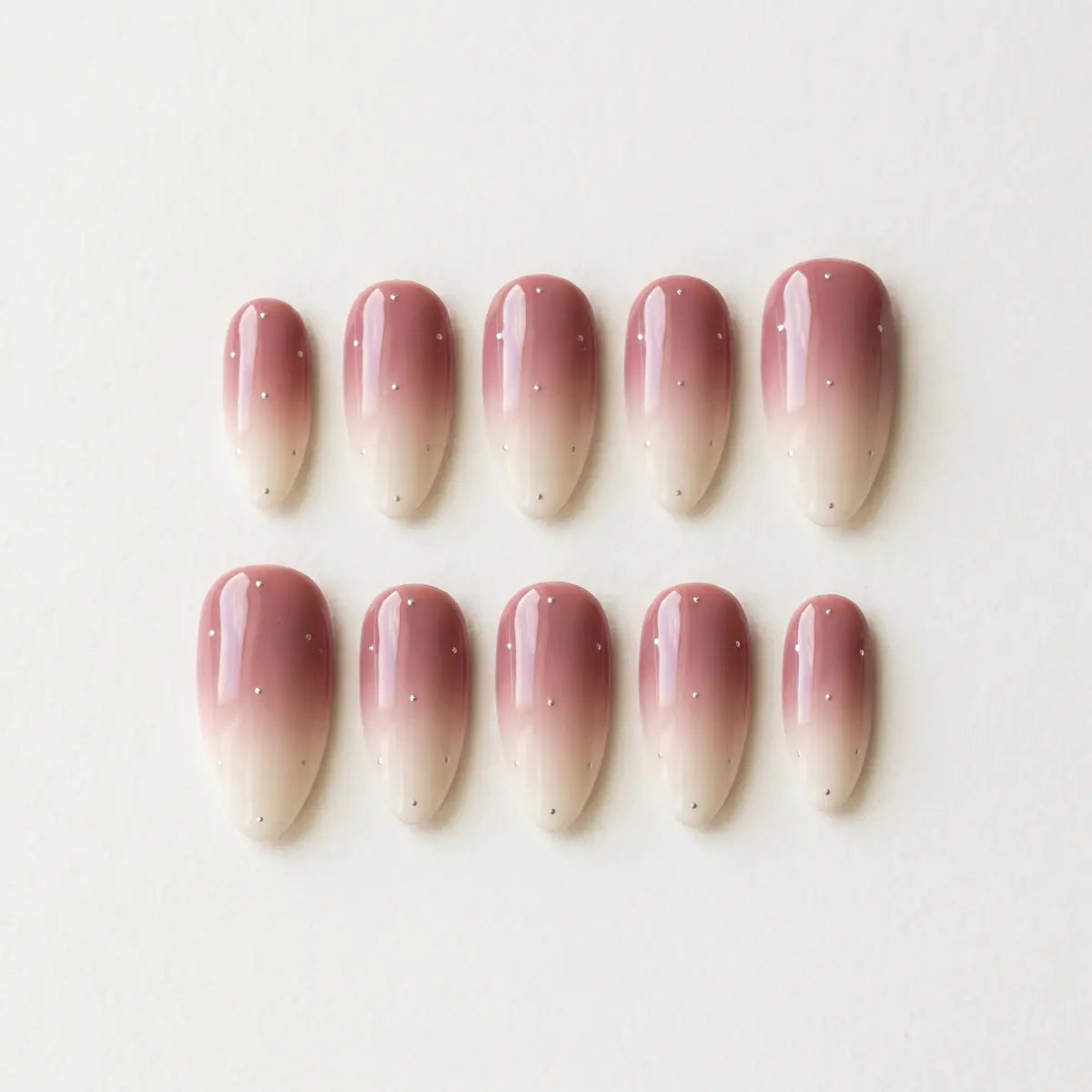 mauve white ombre almond press on nails silver dot flat lay 04