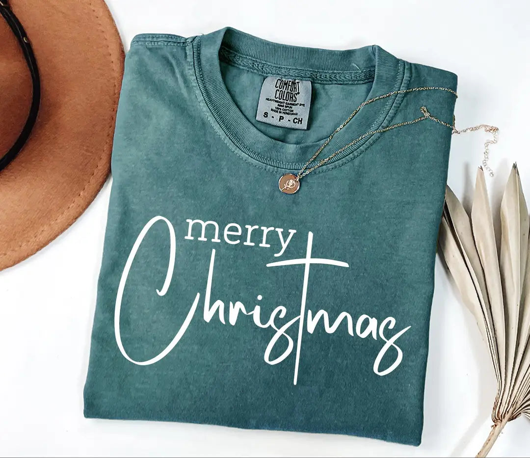 Merry Christmas lettering on Comfort Colors 1717 T-shirt in Blue Spruce.