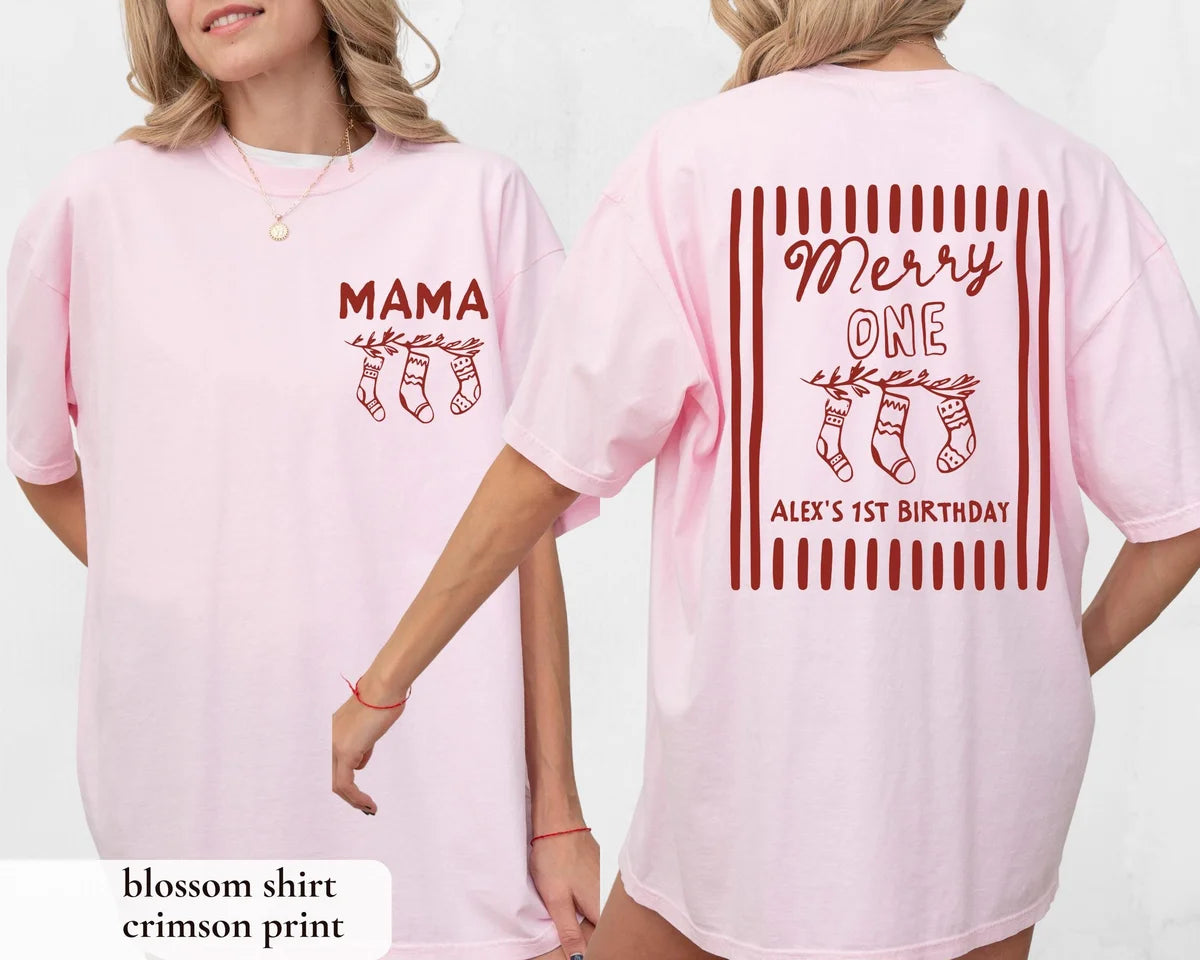 Woman in a Blossom pink Comfort Colors tee, front with a crimson MAMA stocking print and back with Merry ONE
