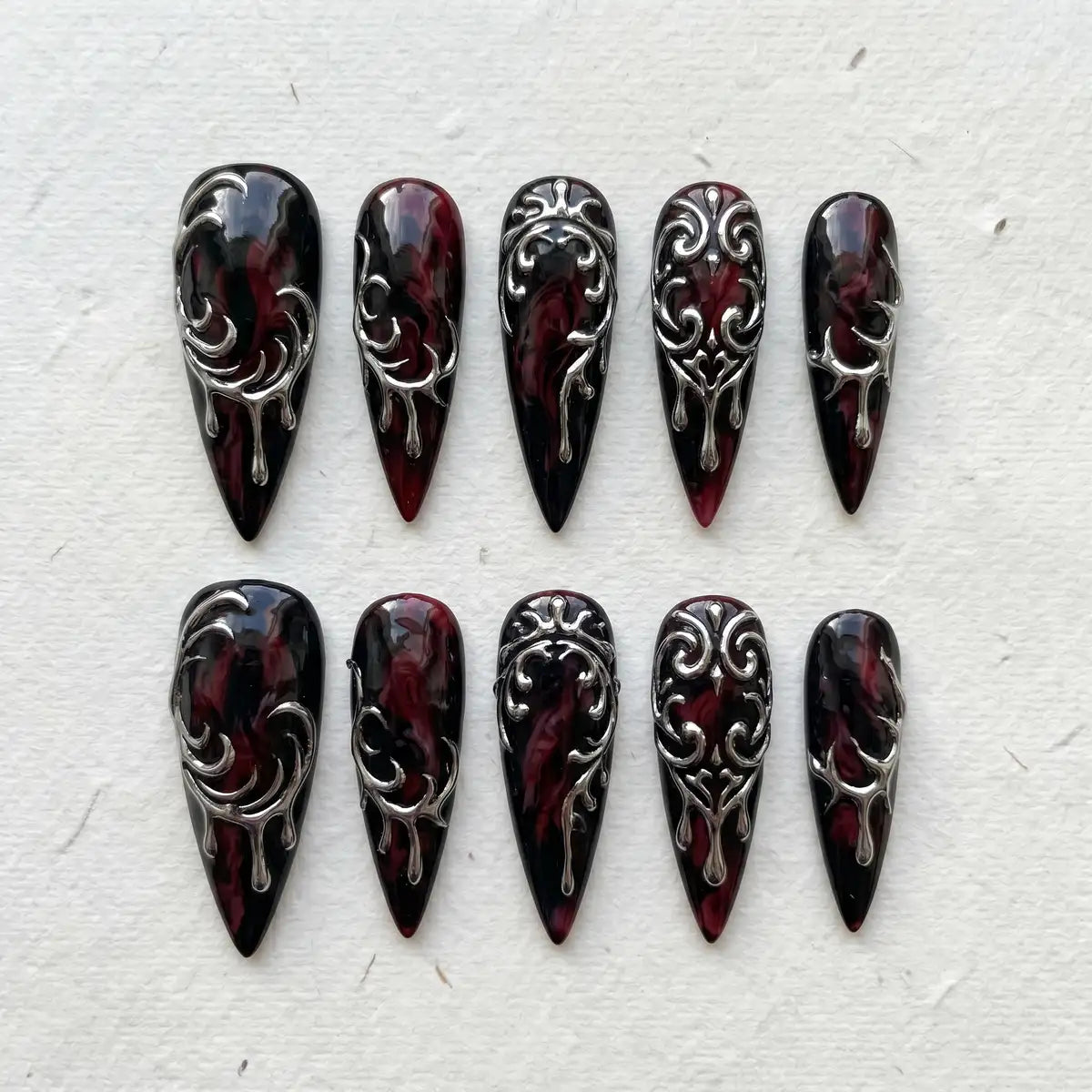 midnight plum 3d stiletto long press on nails silver drip flat lay 01