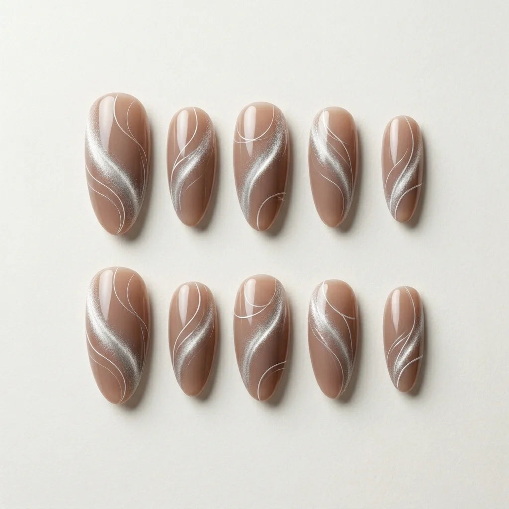 mocha tan cat eye almond long press on nails silver swirl flat lay 04