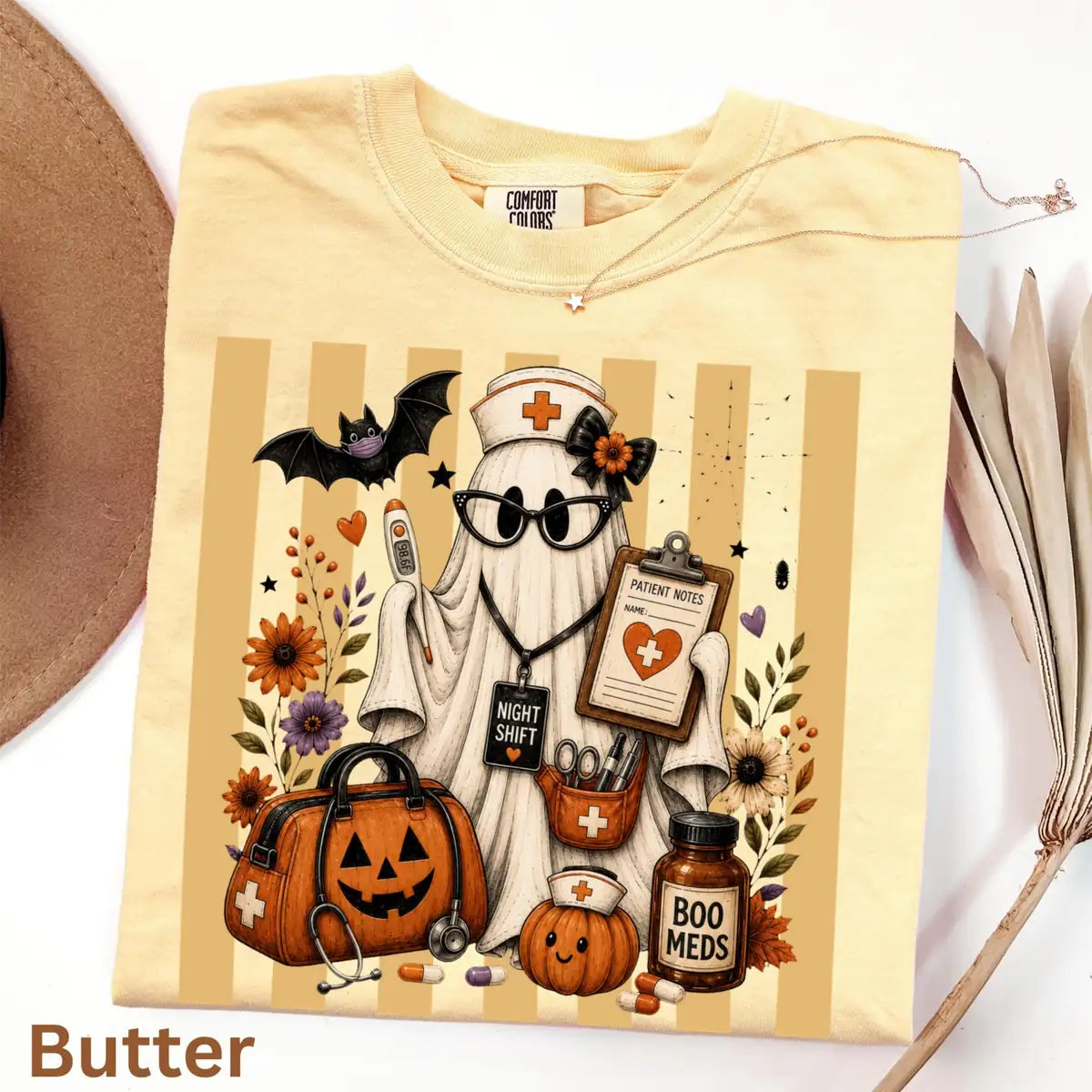 Comfort Colors T-shirt flatlay in Butter color featuring Night Shift nurse ghost graphic