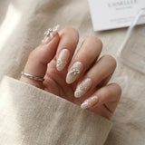 nude 3d almond medium press on nails silver ribbon bow lifestyle 02