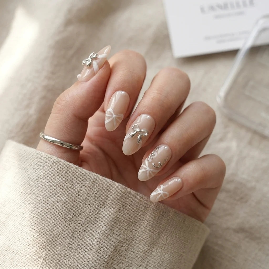 nude 3d almond medium press on nails silver ribbon bow lifestyle 02