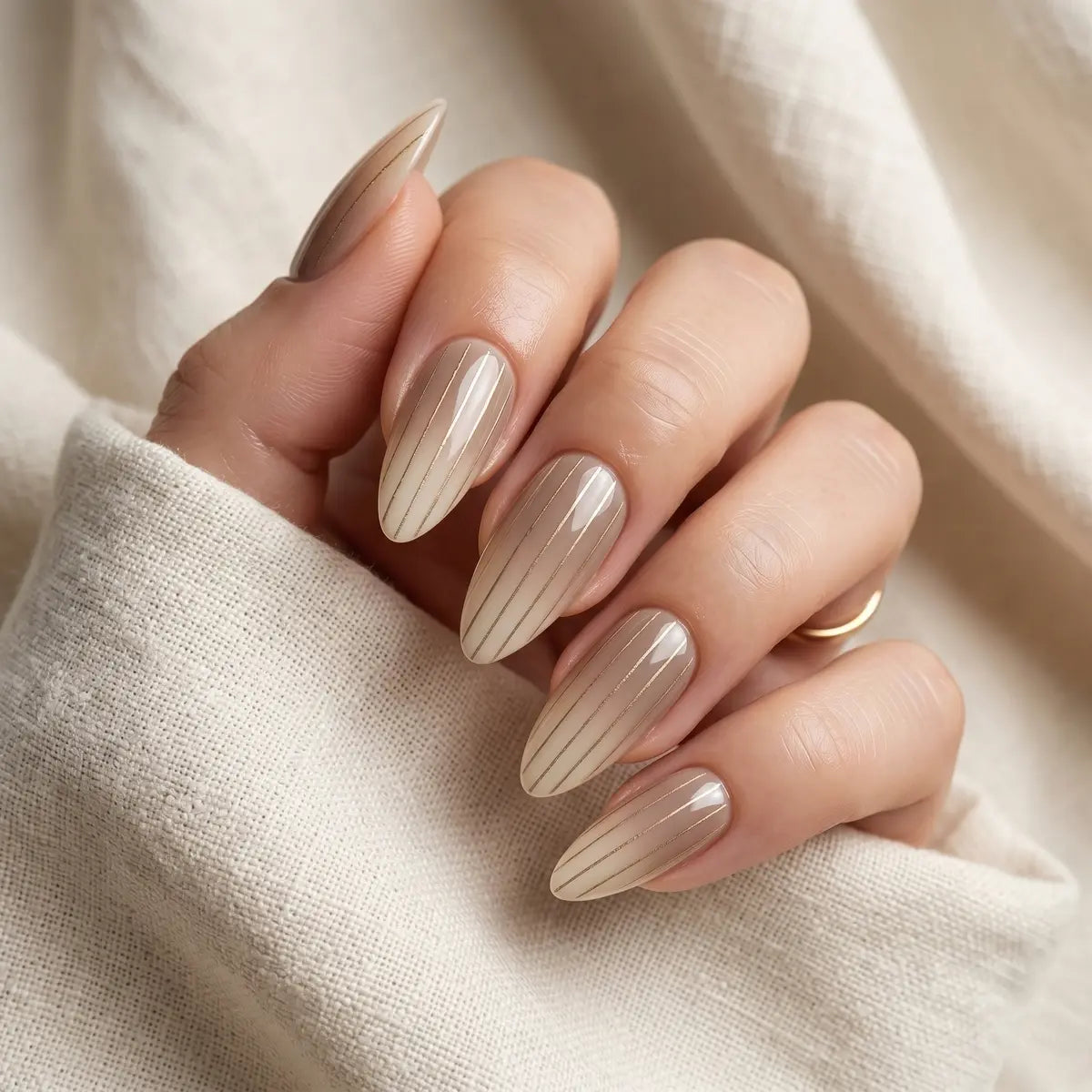 nude beige almond press on nails gold stripe lifestyle 02