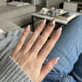 nude glitter almond medium press on nails silver swirl mockup 01