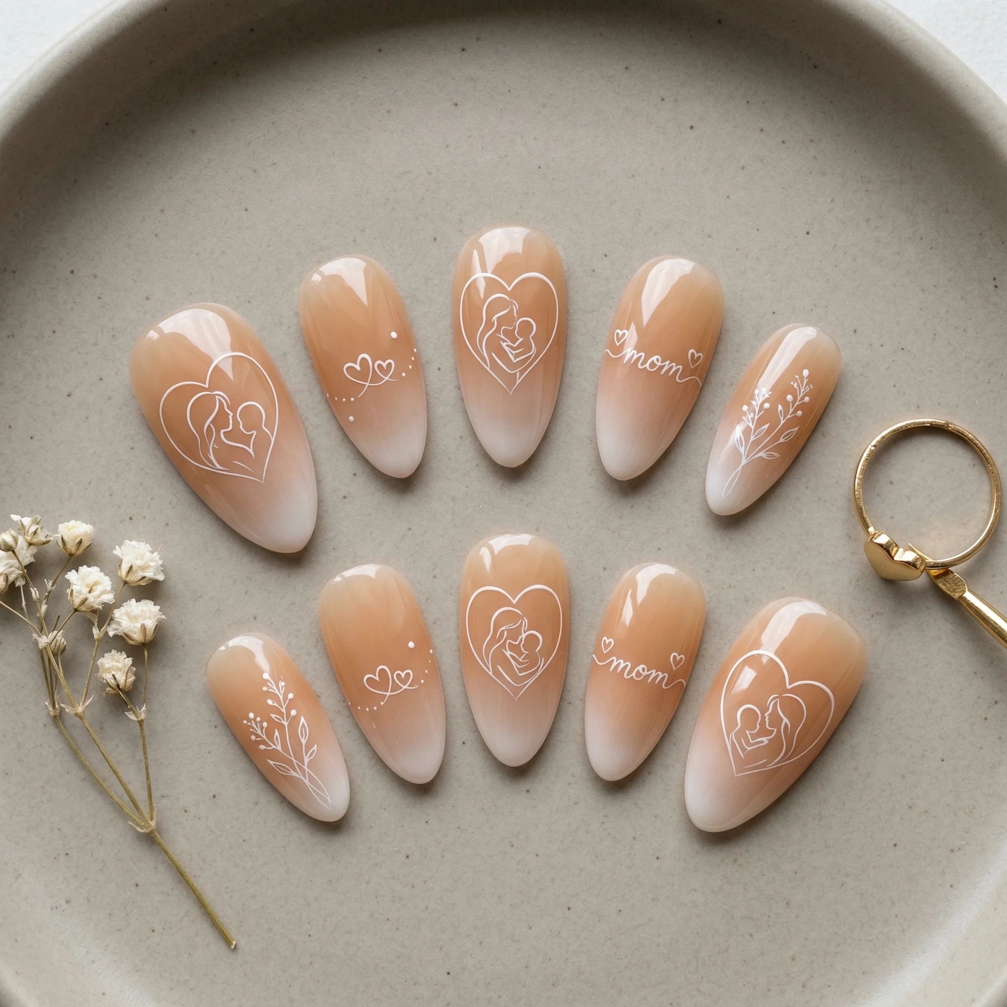 nude hand painted stiletto medium press on nails motherhood heart flat lay 01