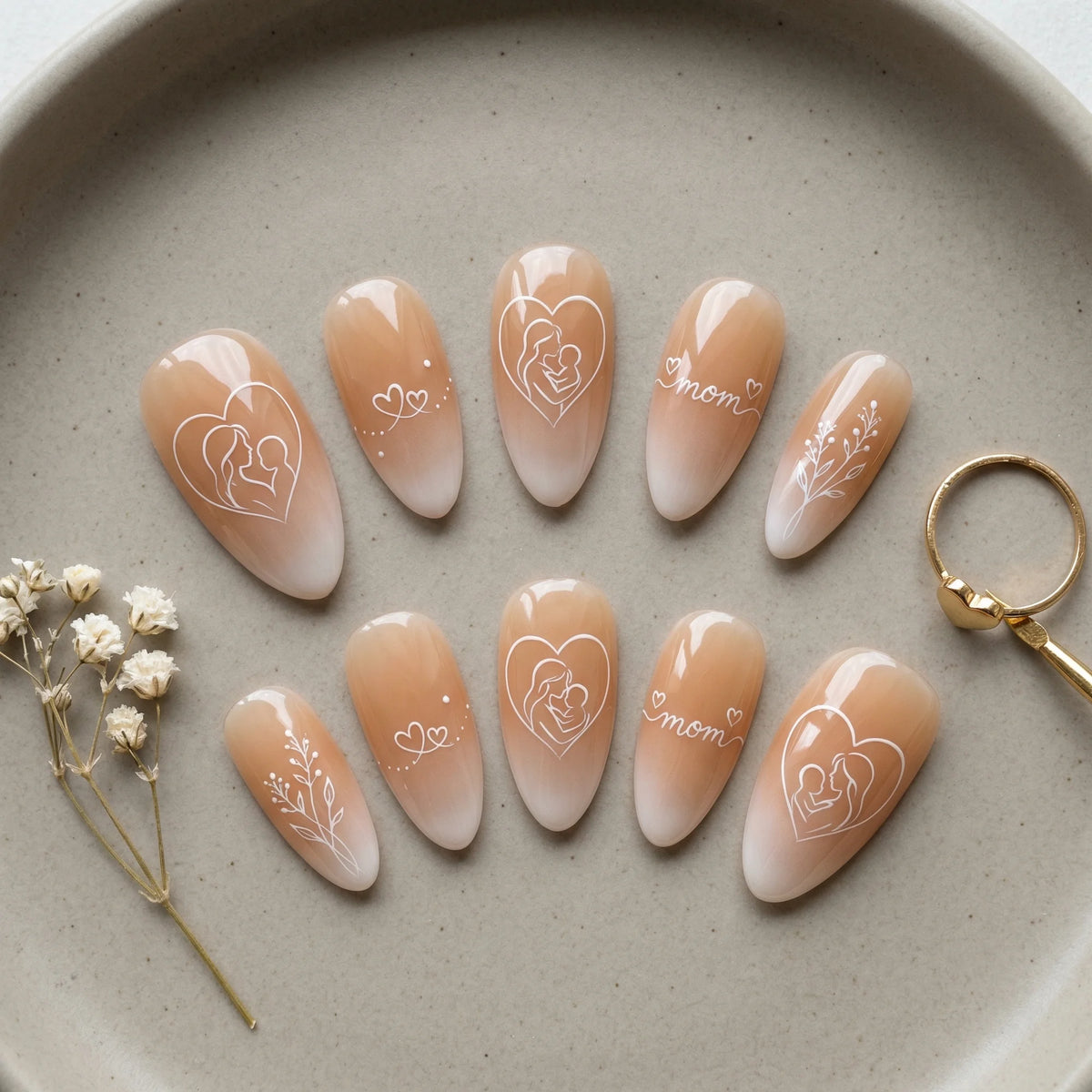 nude hand painted stiletto medium press on nails motherhood heart flat lay 01