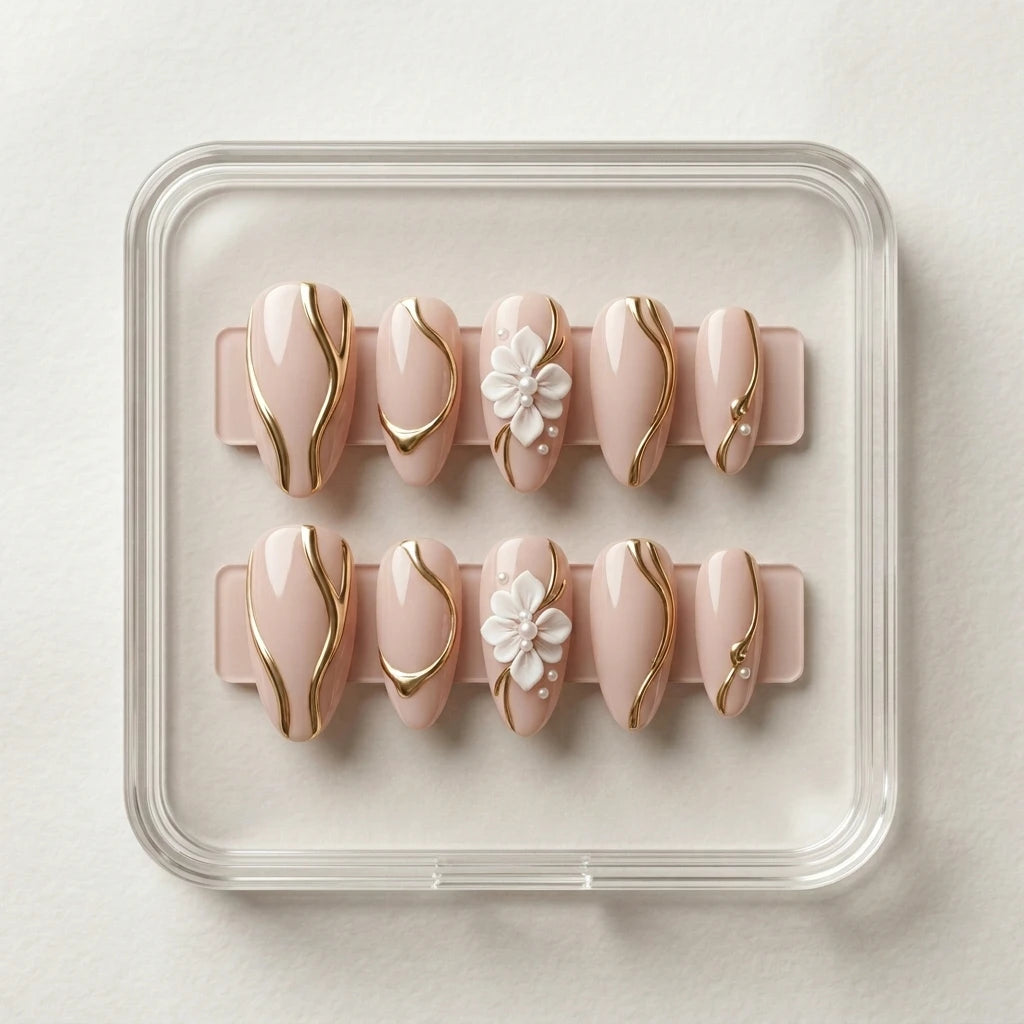 nude pink 3d almond press on nails gold chrome swirl flower flat lay 01