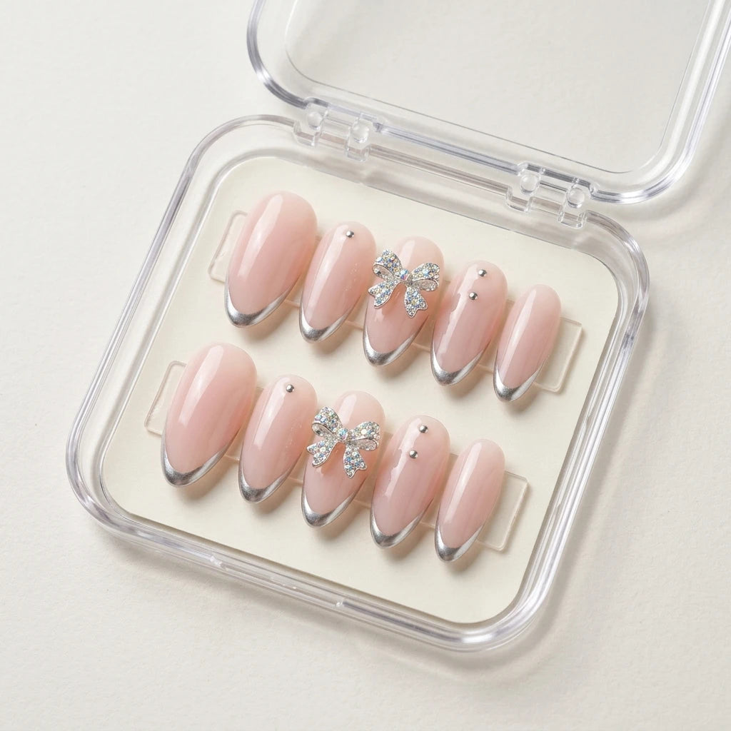nude pink chrome tip almond press on nails 3d bow stud flat lay 01