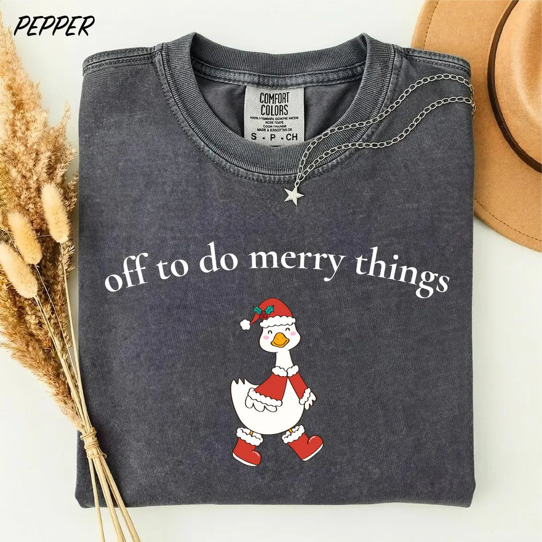 Comfort Colors T-shirt with Off To Do Merry Things holiday design; model photo.