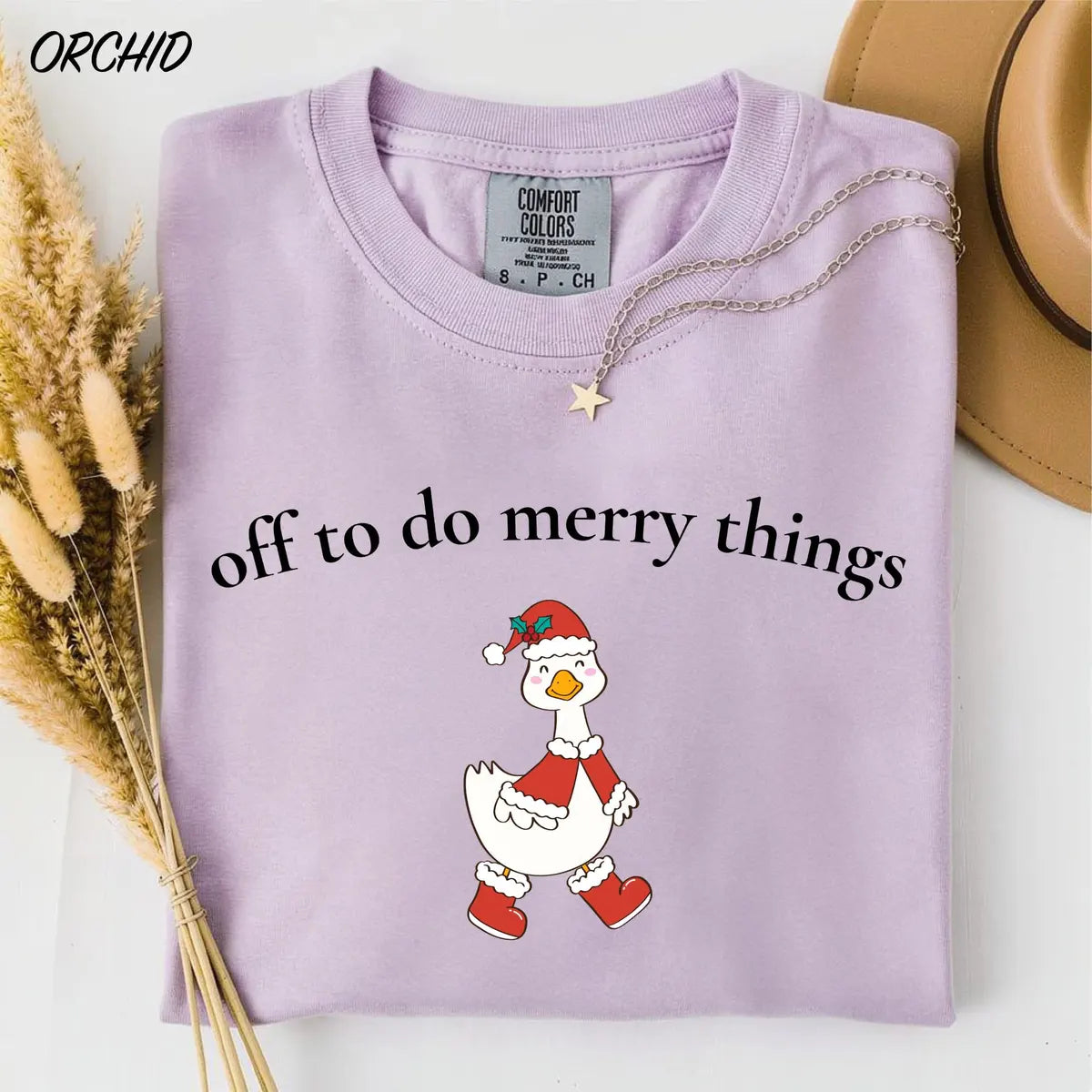 Comfort Colors T-shirt with Off To Do Merry Things holiday design; model photo.