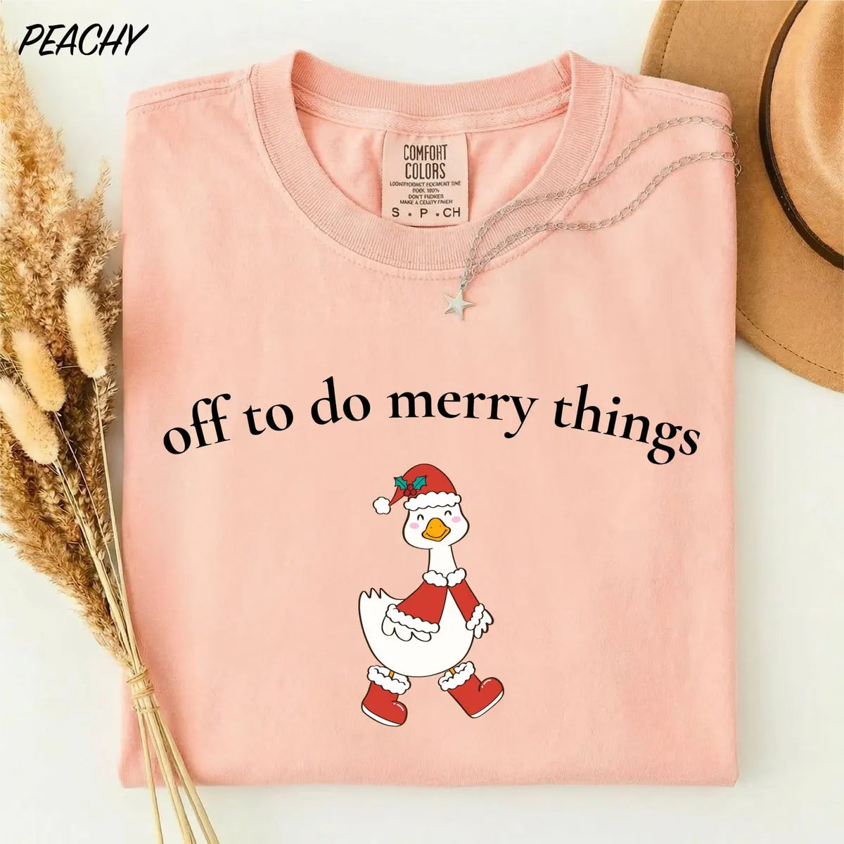Comfort Colors T-shirt with Off To Do Merry Things holiday design; model photo.