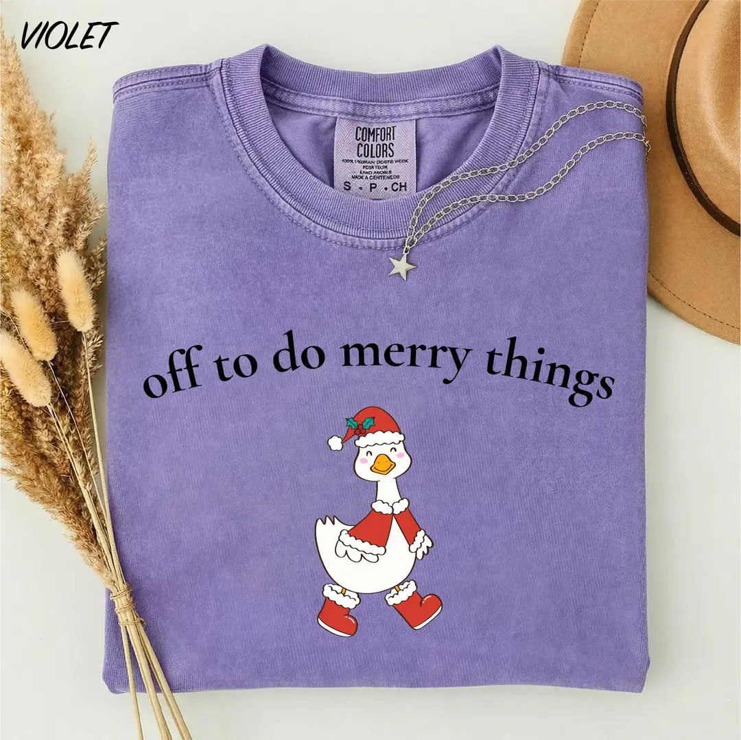 Comfort Colors T-shirt with Off To Do Merry Things holiday design; model photo.