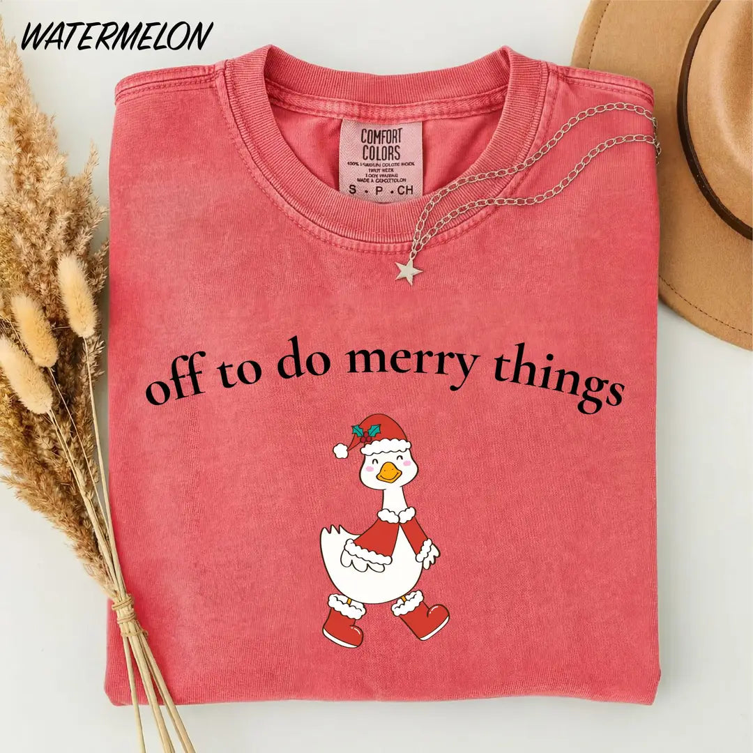 Comfort Colors T-shirt with Off To Do Merry Things holiday design; model photo.