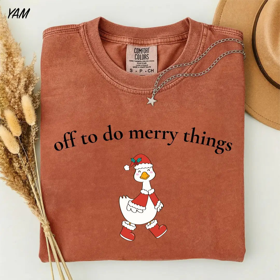 Comfort Colors T-shirt with Off To Do Merry Things holiday design; model photo.