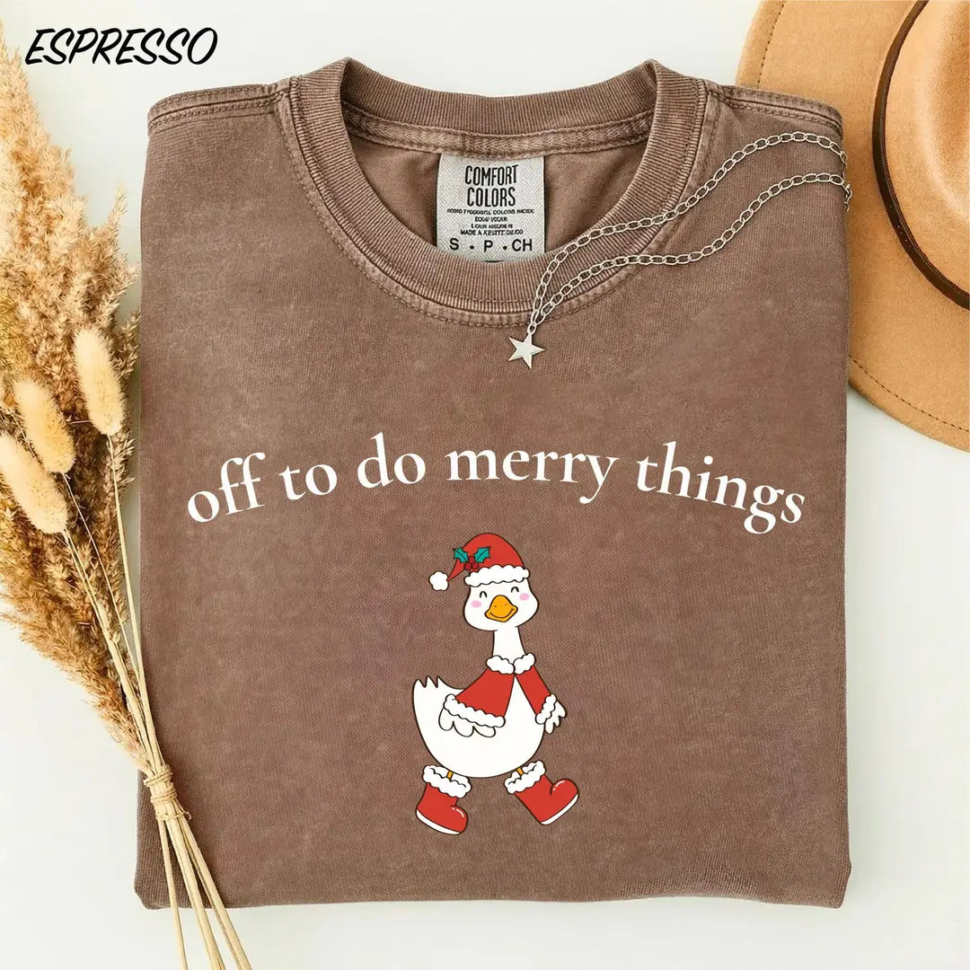 Comfort Colors T-shirt with Off To Do Merry Things holiday design; model photo.