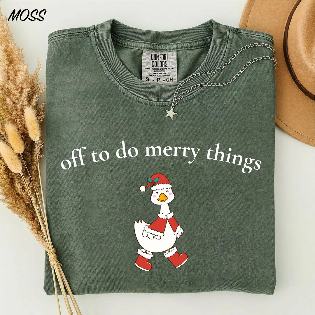 Comfort Colors T-shirt with Off To Do Merry Things holiday design; model photo.
