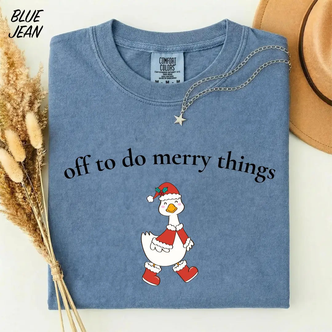 Comfort Colors T-shirt with Off To Do Merry Things holiday design; model photo.