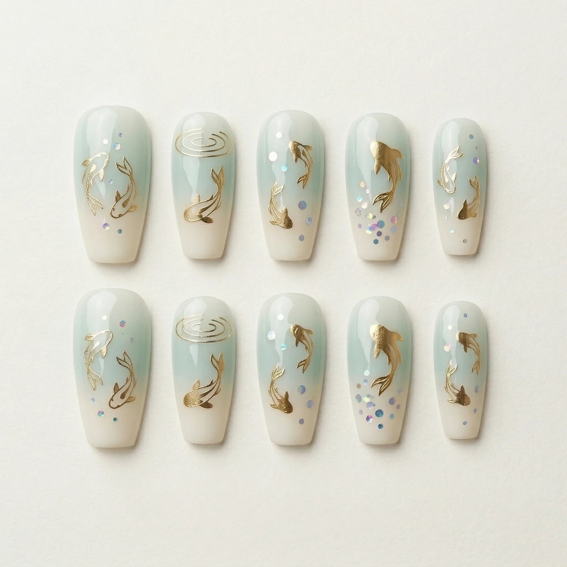 pale blue ombre coffin medium press on nails golden koi fish flat lay 01