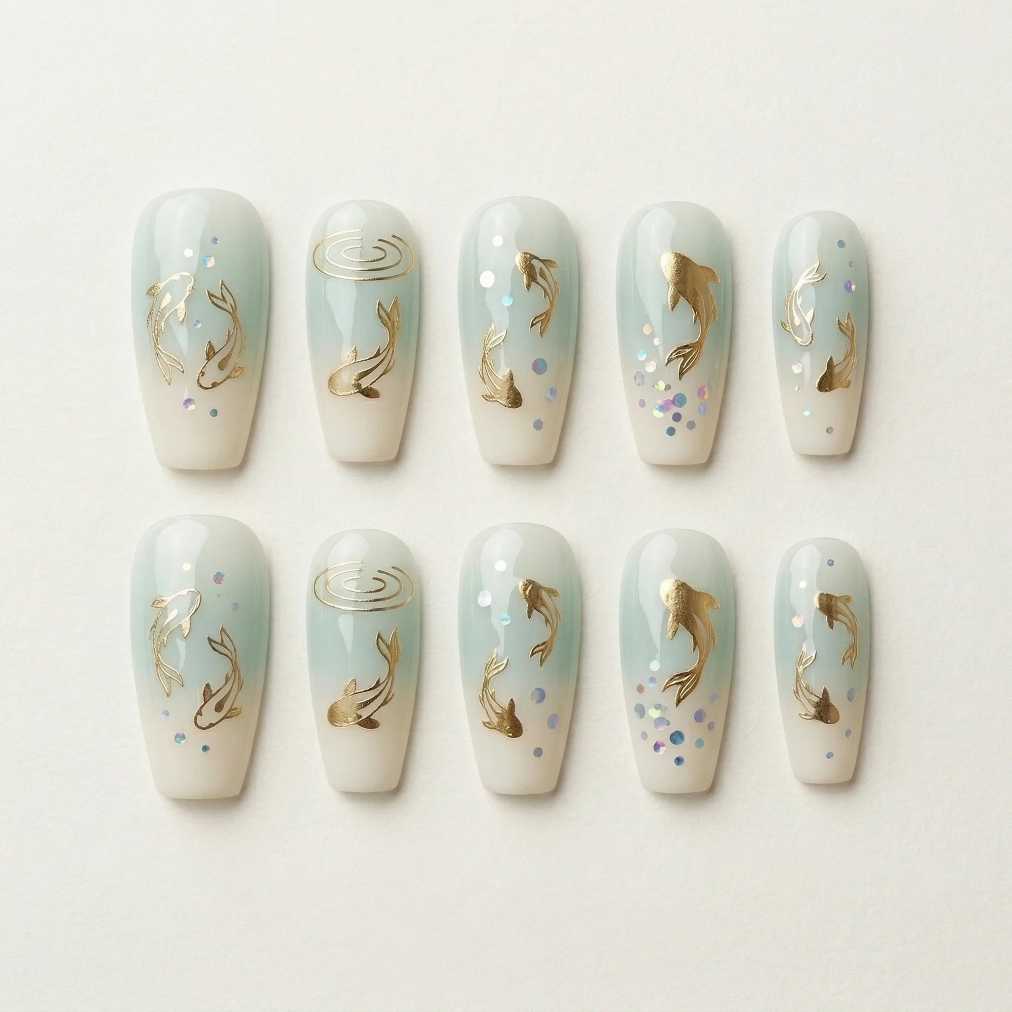 pale blue ombre coffin medium press on nails golden koi fish flat lay 01