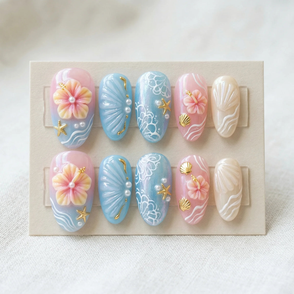 pastel 3d almond medium press on nails hibiscus golden seashell flat lay 01