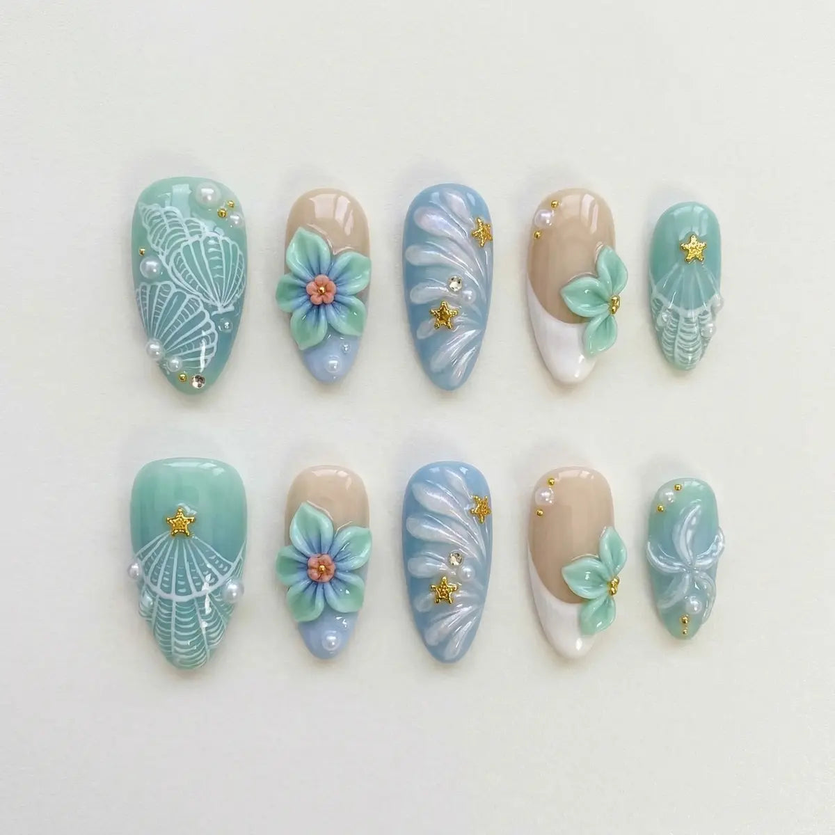 pastel blue 3d flower almond press on nails shell engraved pearl star flat lay 01