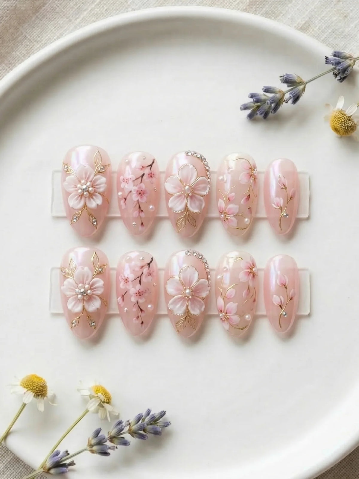 pearl pink hand painted almond medium press on nails flat lay 01