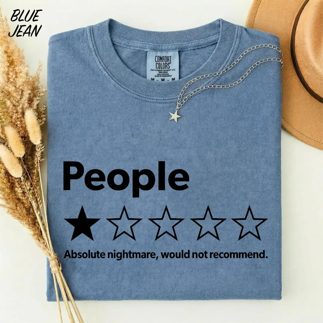 Blue Jean Comfort Colors 1717 T-shirt with black People one-star review graphic and 'Absolute nightmare, would not recommend' wording.