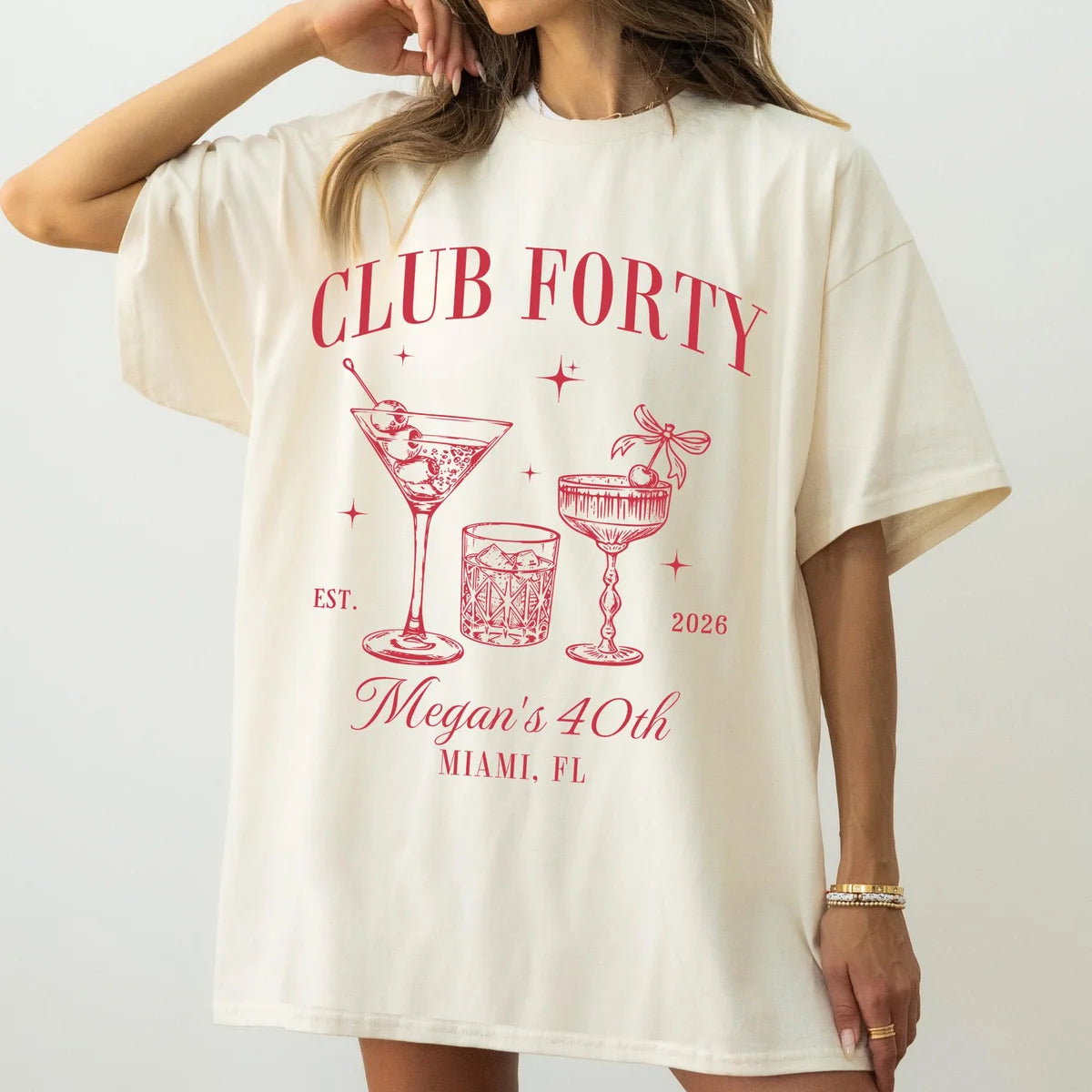 Ivory Comfort Colors 1717 T-shirt with red Club Forty cocktail-glass artwork and example personalized name, year and destination.