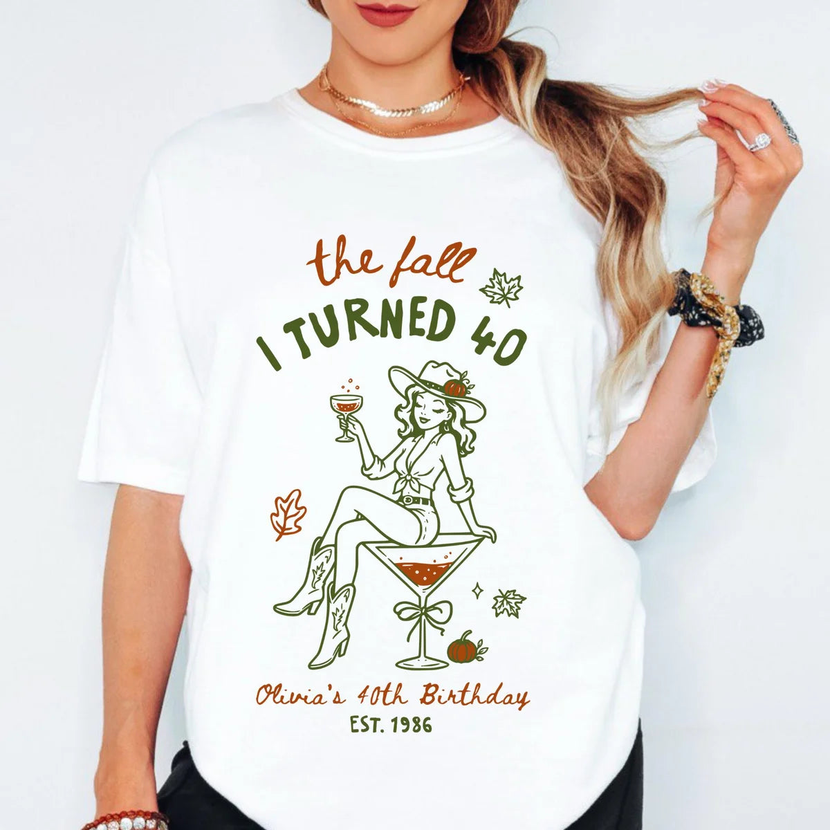 White Comfort Colors T-shirt with The Fall I Turned 40 birthday artwork in orange and green.