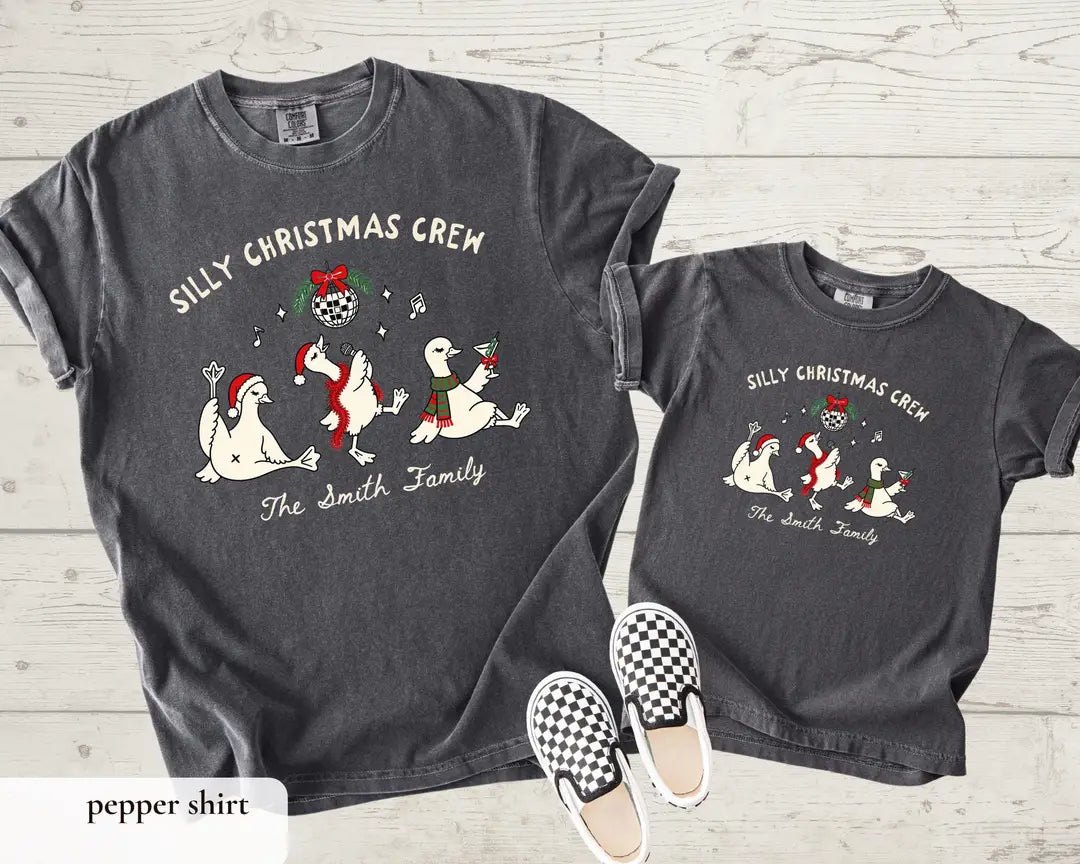 Silly Christmas Crew personalized geese graphic on charcoal Pepper Comfort Colors T-shirts.