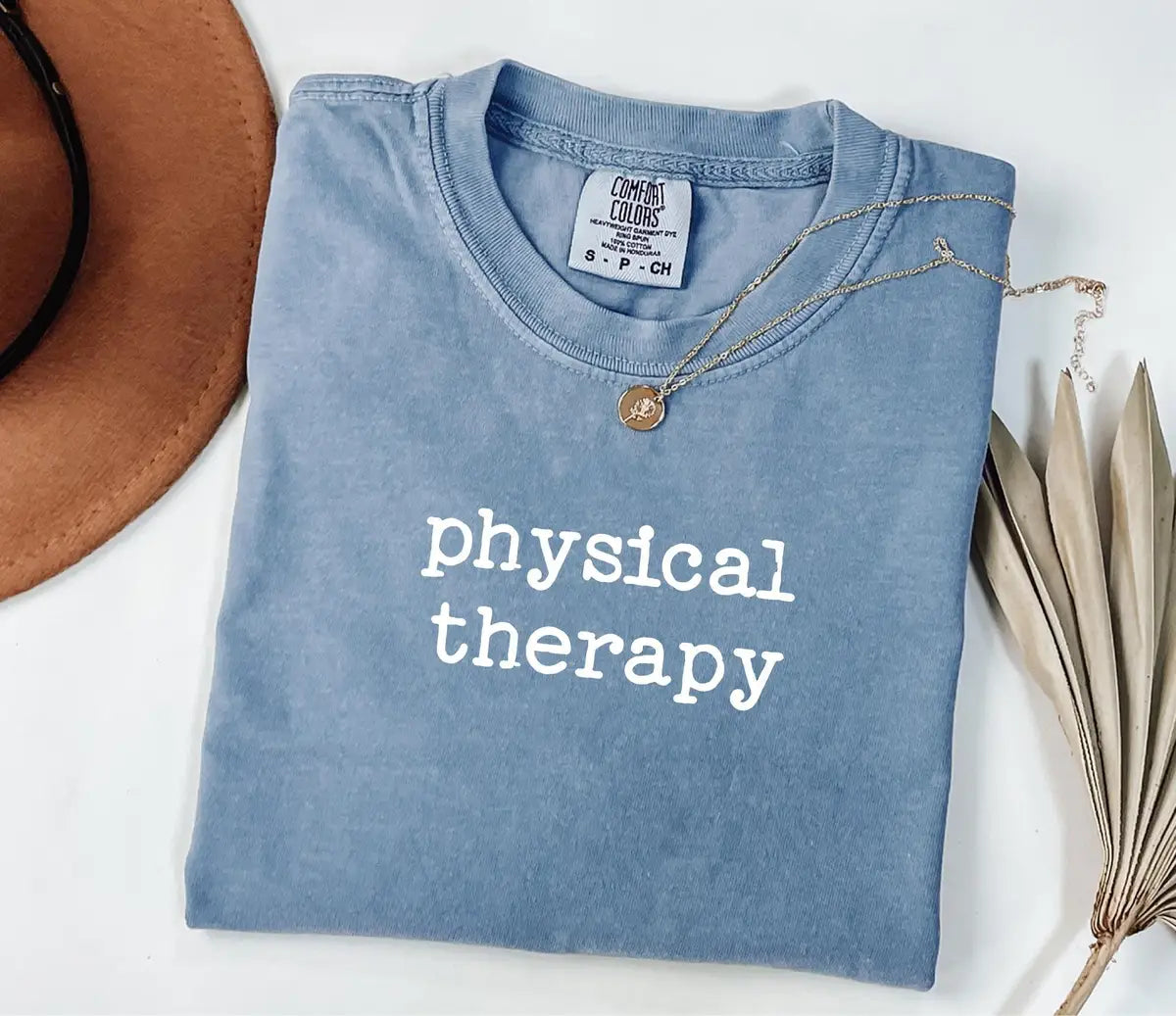 Blue Jean Comfort Colors 1717 tee with lowercase 'physical therapy' in white lettering.