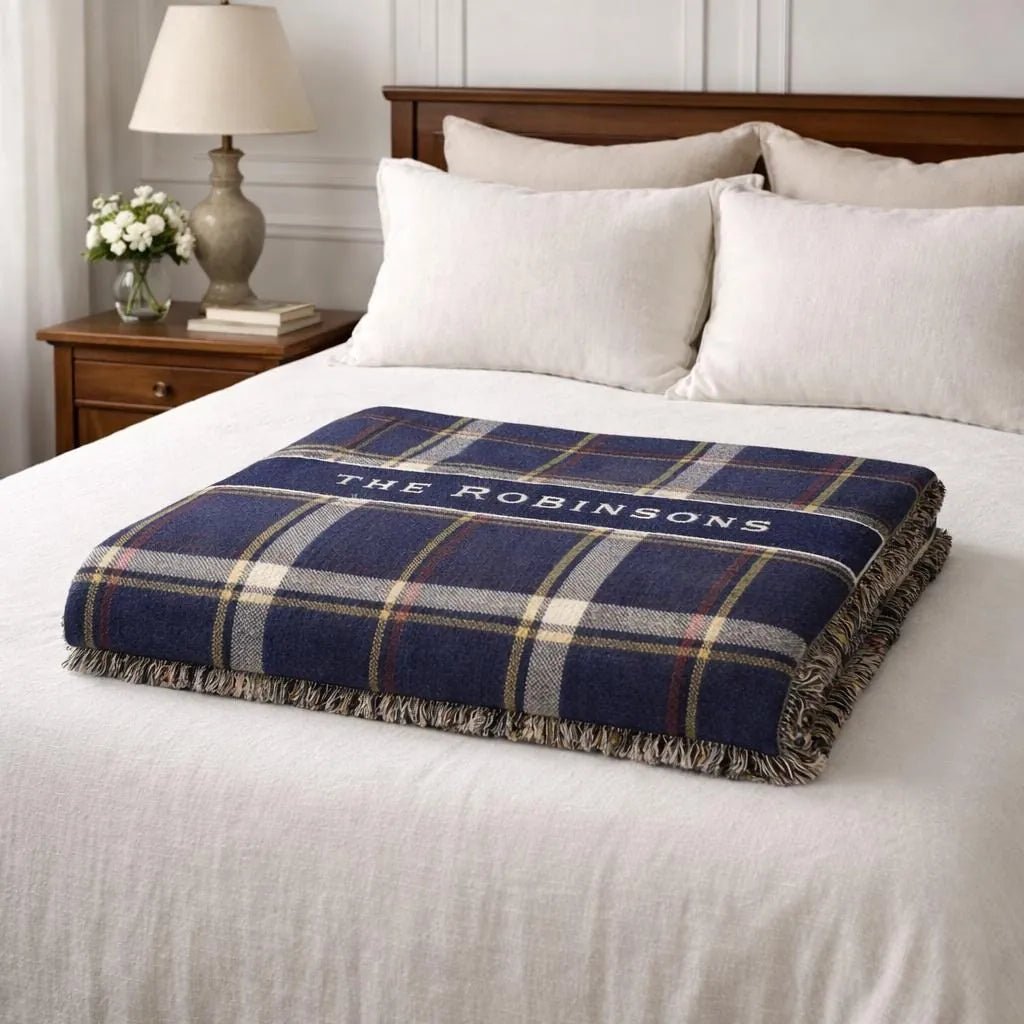 Close-up of the personalized plaid banner woven blanket with texture and fringe detail