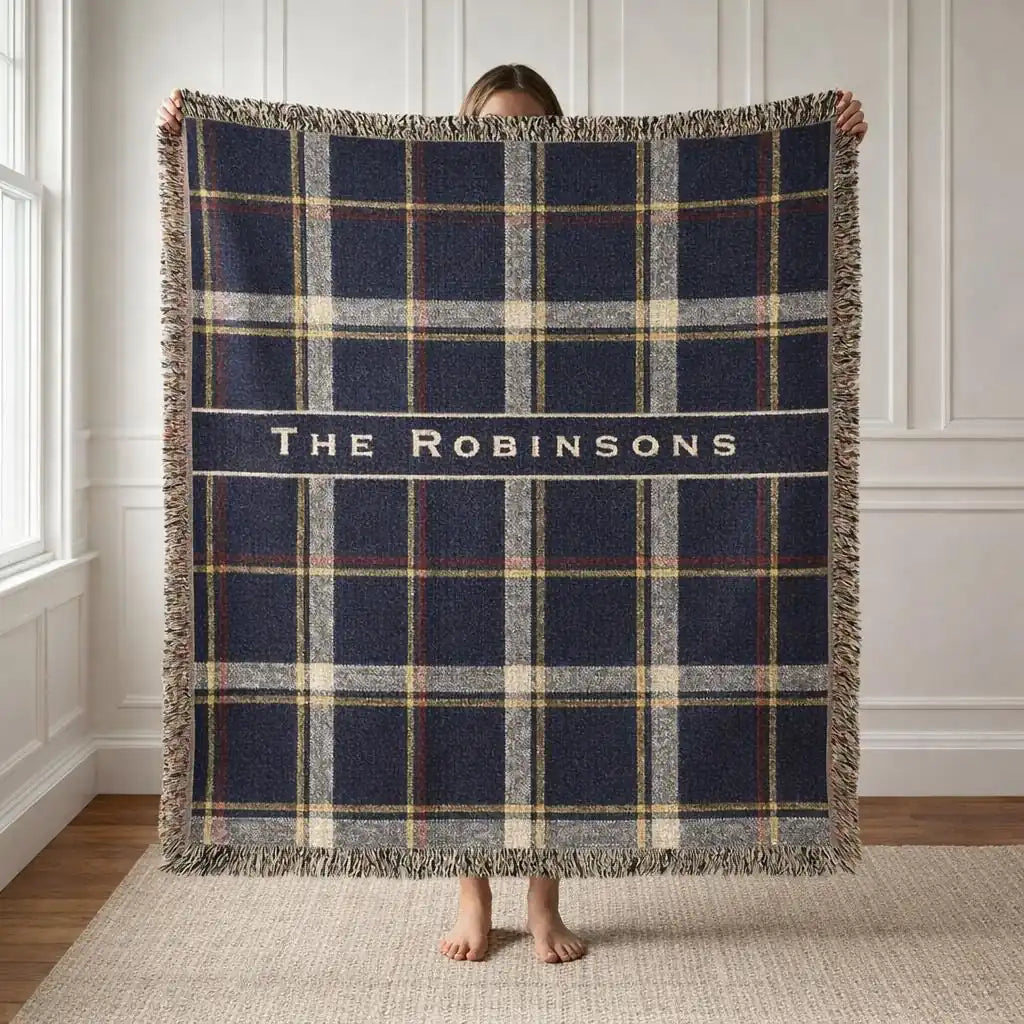 Personalized plaid banner woven blanket shown in a styled room setting