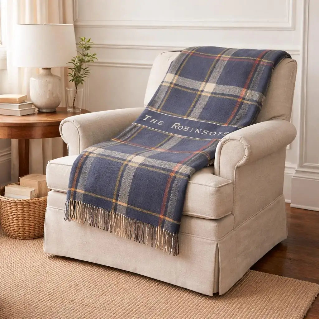 Personalized plaid banner woven blanket shown in a styled room setting