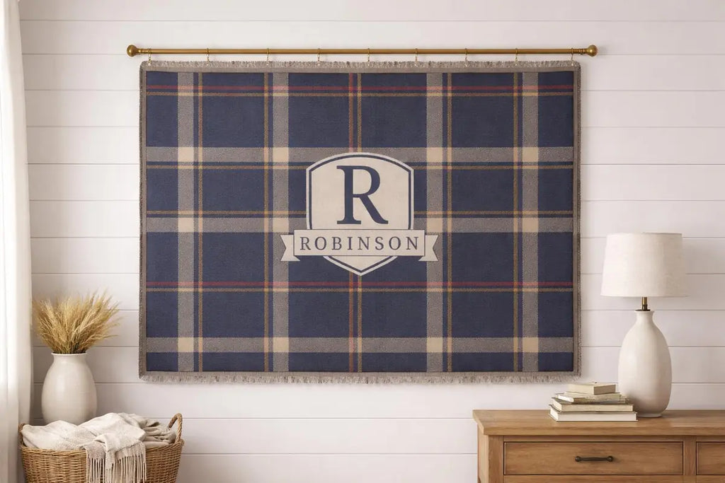 Close-up of the personalized plaid crest woven blanket with texture and fringe detail