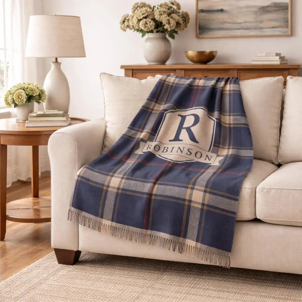 Close-up of the personalized plaid crest woven blanket with texture and fringe detail