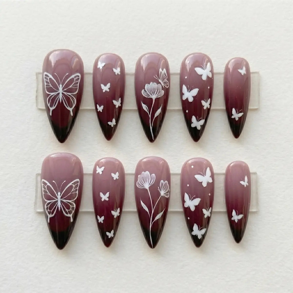 plum ombre hand painted stiletto long press on nails butterfly floral flat lay 01