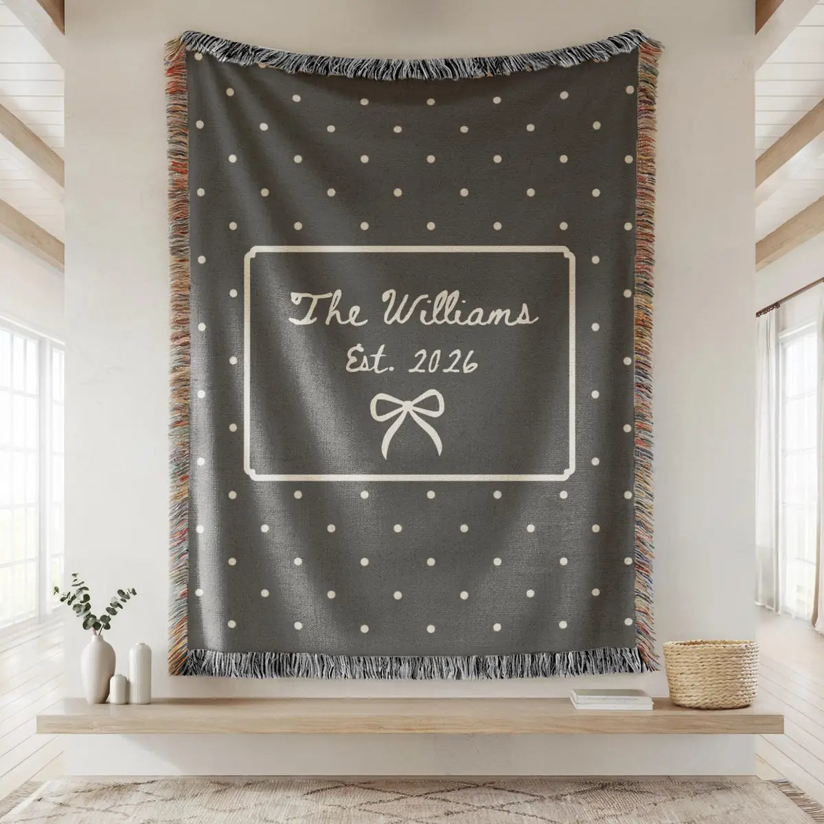 Close-up of the personalized polka dot bow woven blanket with texture and fringe detail
