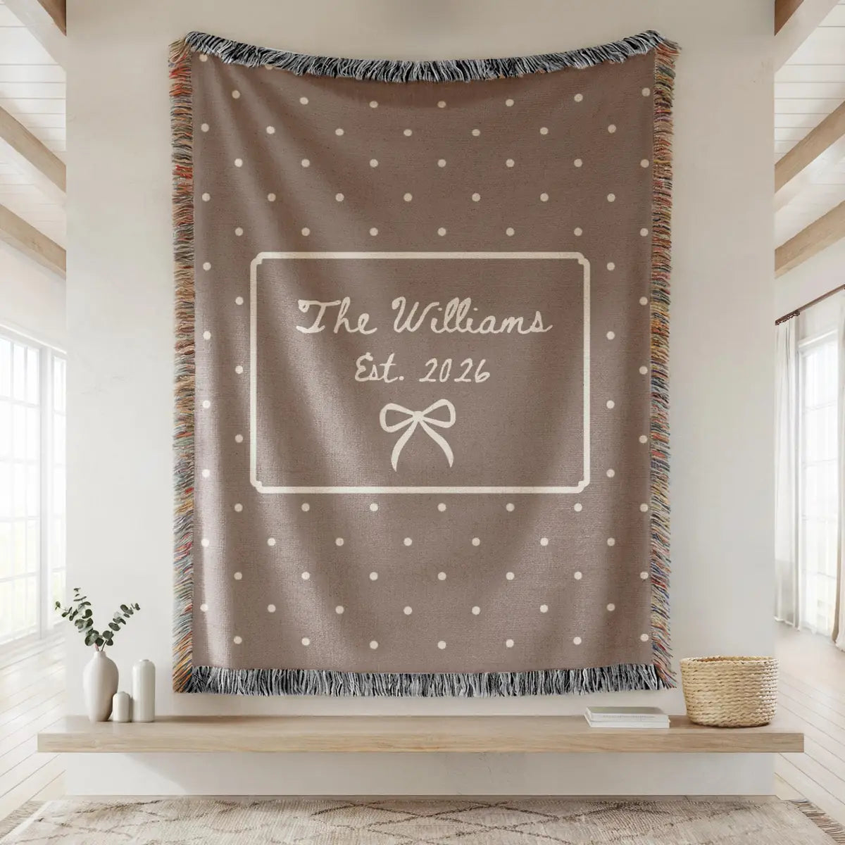 Close-up of the personalized polka dot bow woven blanket with texture and fringe detail