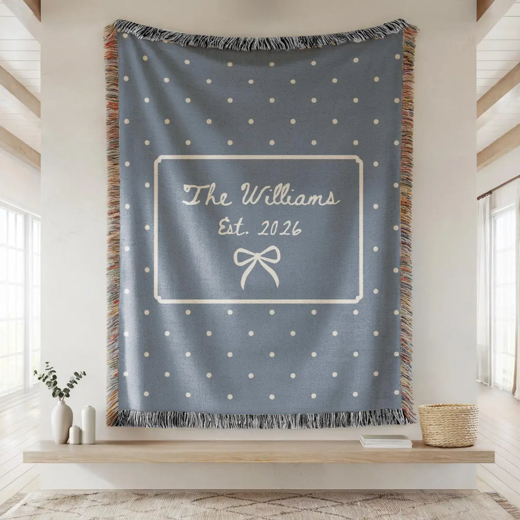 Personalized polka dot bow woven blanket shown in a styled room setting