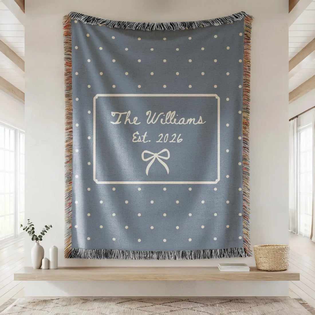 Personalized polka dot bow woven blanket shown in a styled room setting