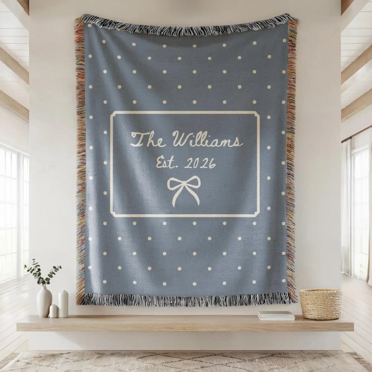 Personalized polka dot bow woven blanket shown in a styled room setting