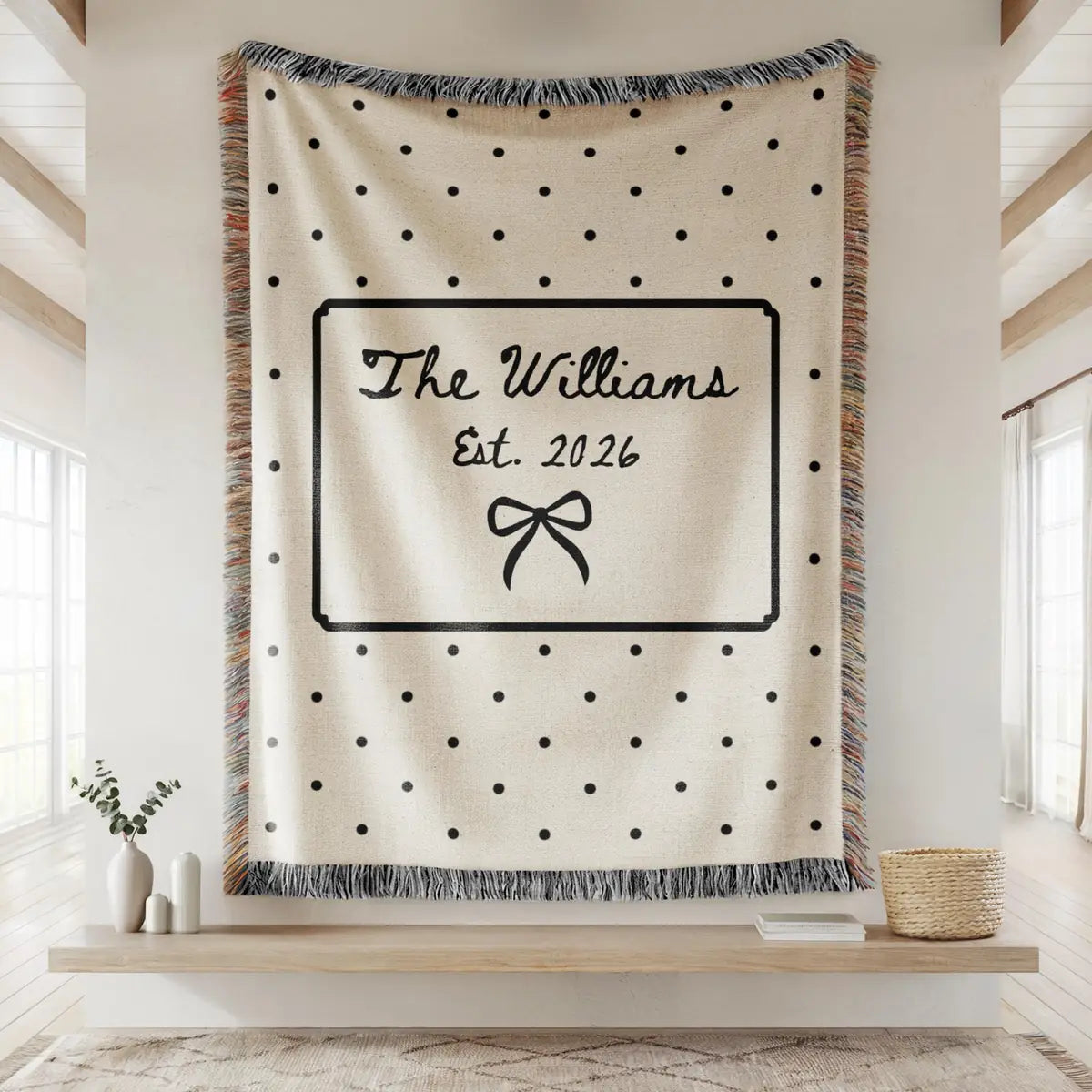 Personalized polka dot bow woven blanket shown in a styled room setting